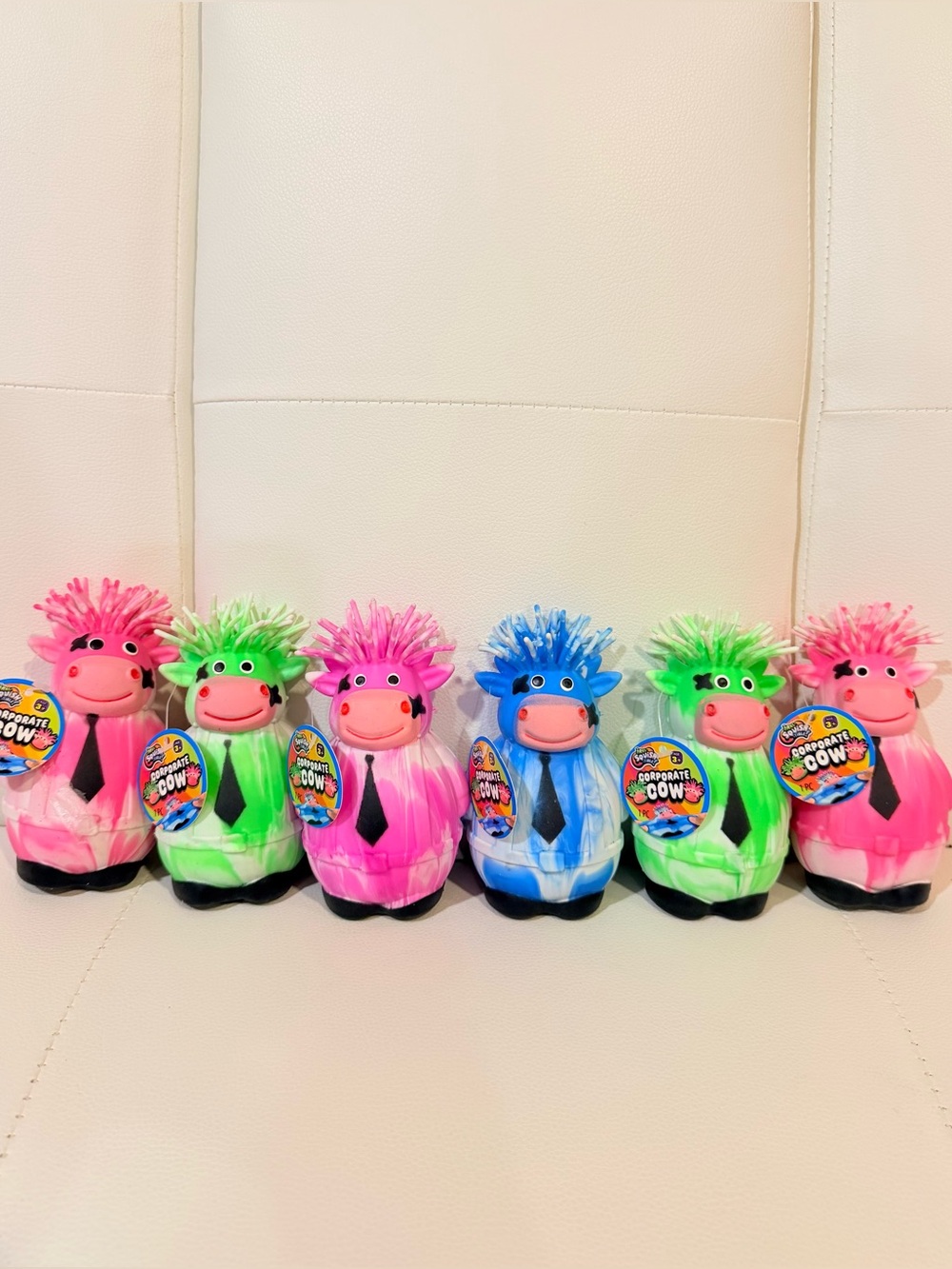 Scent-Sational Colorful Cow Plush Toy - Pink, Green, Blue, Purple.